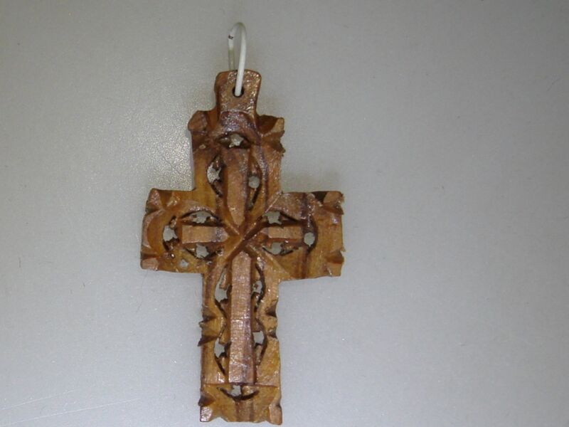 Vintage Russian carved wooden cross pendant with intricate openwork design.