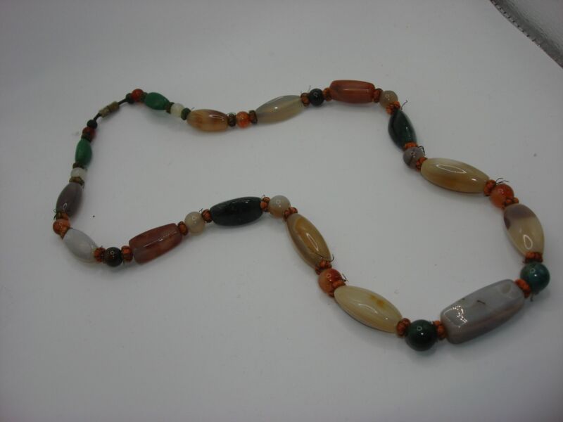Vintage gemstone necklace featuring quartz, amethyst, and onyx