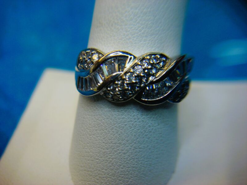 Sterling silver ring with round and baguette stones, size 10 (excellent pre-owned condition)