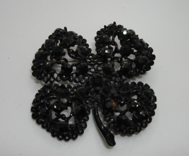 Vintage black rhinestone filigree clover brooch