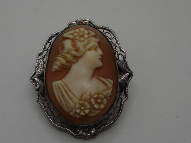 Antique Art Nouveau sterling silver cameo brooch with floral design, circa 1920s