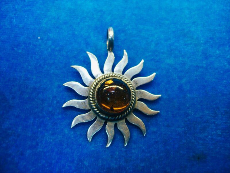 Genuine amber sun pendant in sterling silver, pre-owned excellent condition