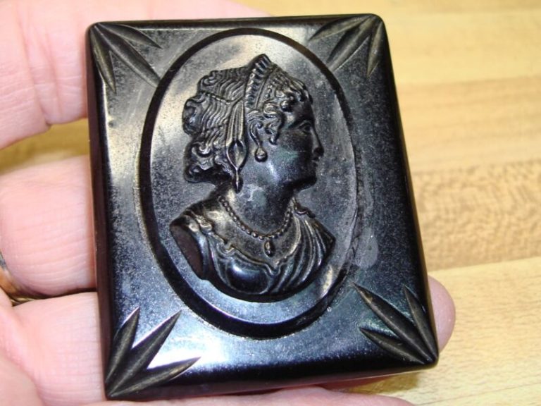 Antique gutta percha cameo brooch featuring a Victorian lady portrait