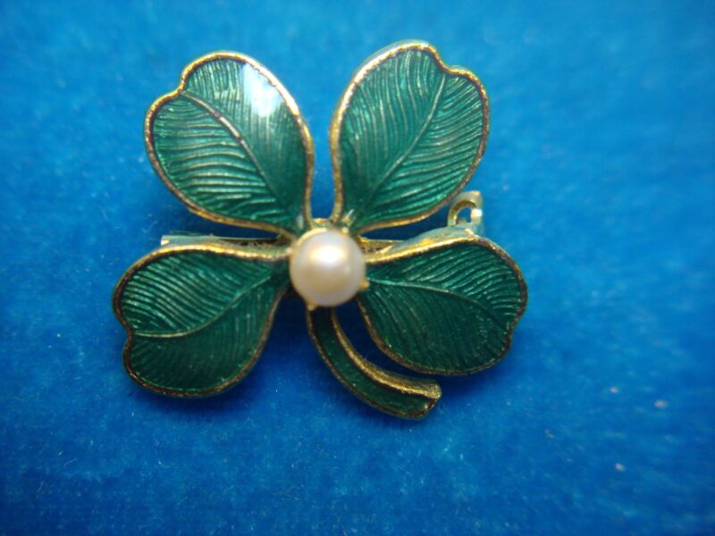 Gold-tone four leaf clover pin with green enamel and faux pearl center