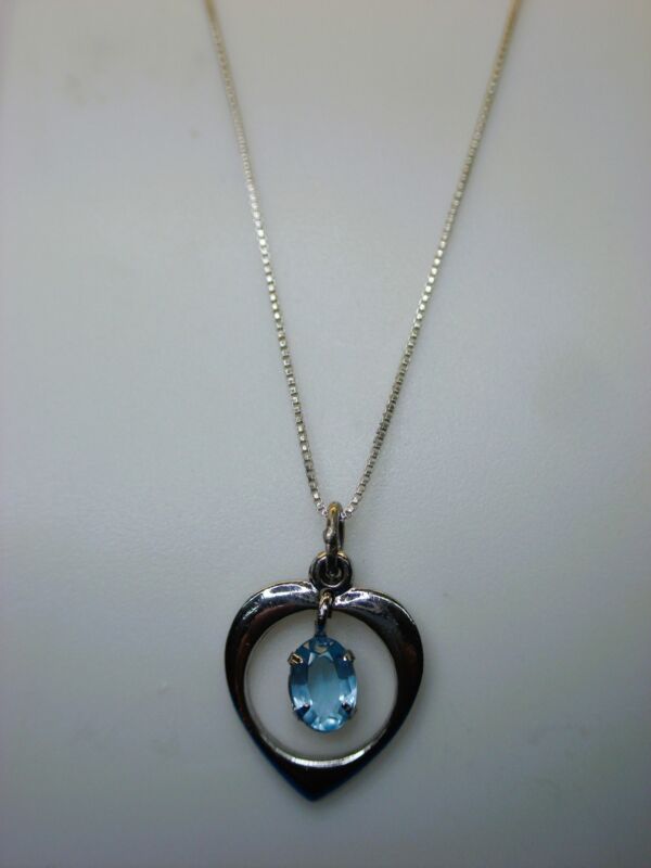 Sterling silver heart pendant with light blue stone and 18-inch chain