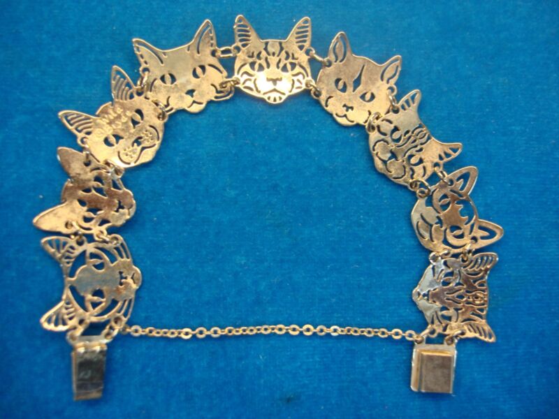Gold-plated cat head bracelet with seven unique hinged cat heads
