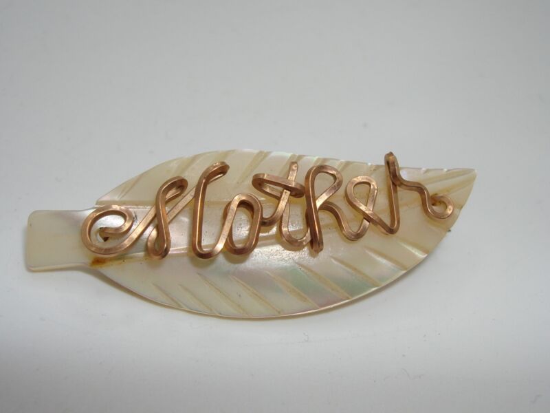 Vintage 1930s-40s mother of pearl feather pin with 'Mother' design