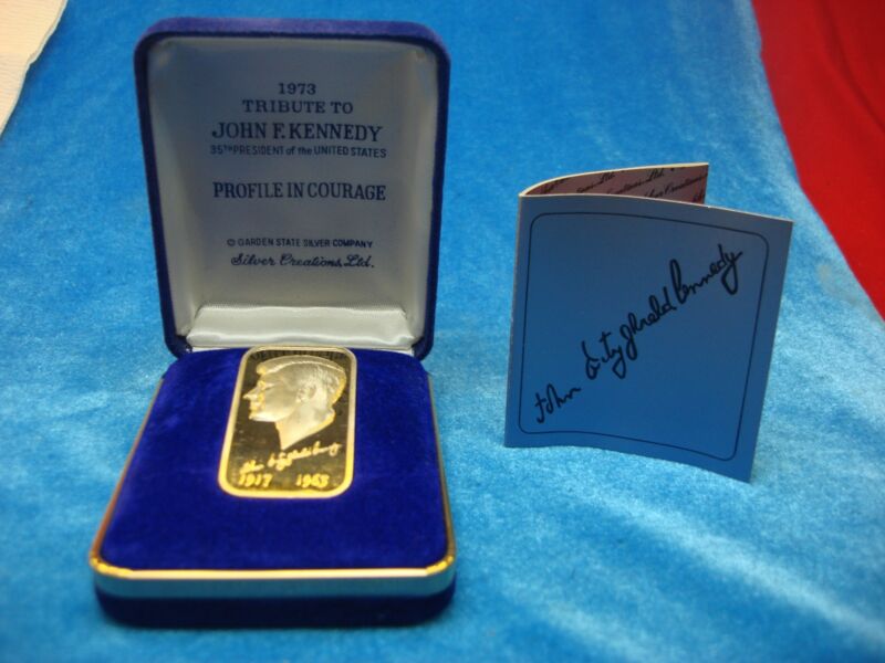 1973 John F. Kennedy 1 oz .999 Fine Silver Bar with gold accents, in original box and papers.