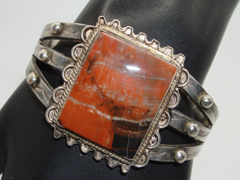 Vintage 1940s Navajo sterling silver cuff bracelet with petrified wood inlay