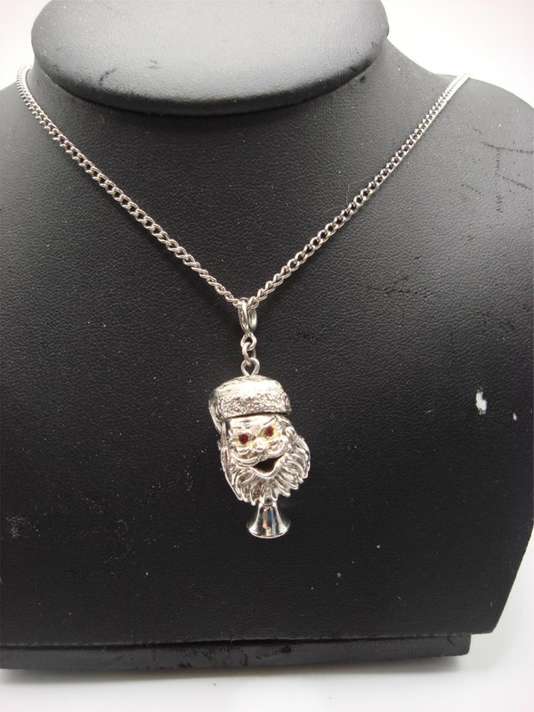 Vintage Monet articulated Santa Claus pendant necklace with sparkling red rhinestones and a 24-inch chain