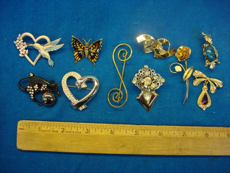Lot of 10 vintage estate costume pins with unique and diverse designs