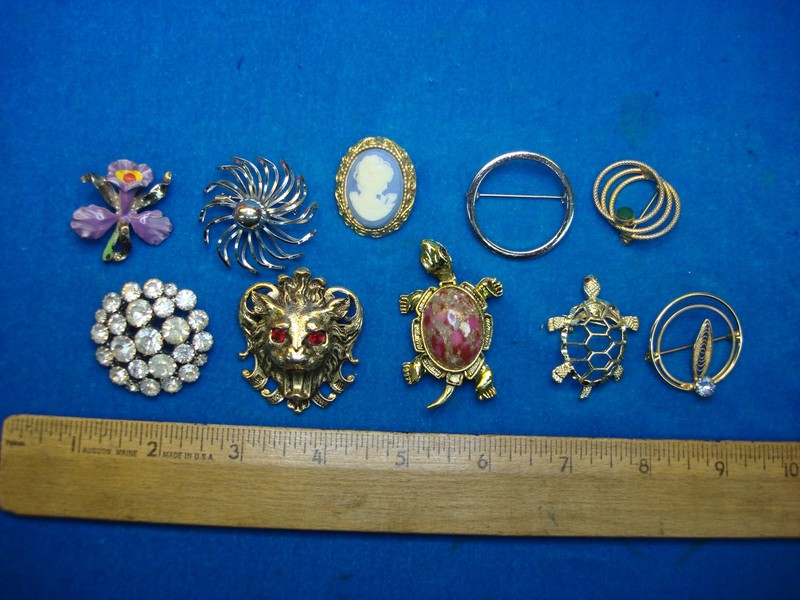 Lot of 10 vintage costume pins with unique designs
