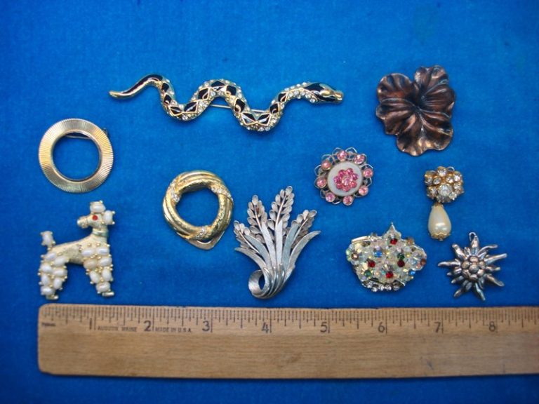 Set of 10 vintage costume pins with unique designs