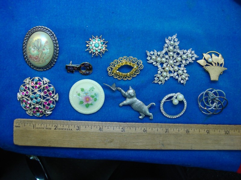 Set of 10 vintage costume pins with unique designs