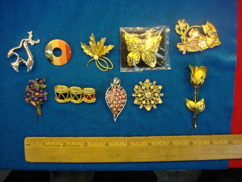 Vintage costume pin lot of 10 with unique designs, estate jewelry collection