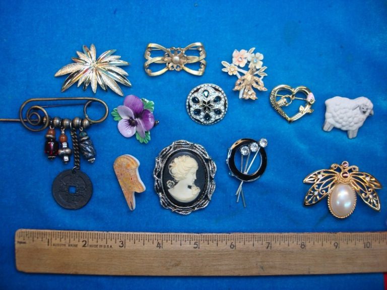 Ten unique and usable costume pins in an estate jewelry lot
