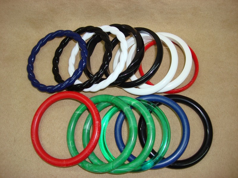 Set of 14 vintage Lucite bangle bracelets in red, white, black, blue, and green