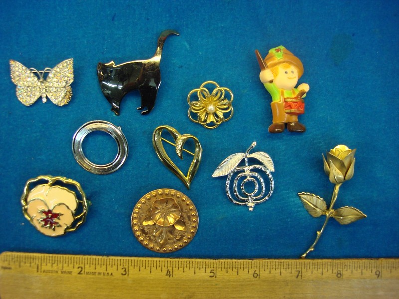 Lot of 10 vintage costume pins with unique designs