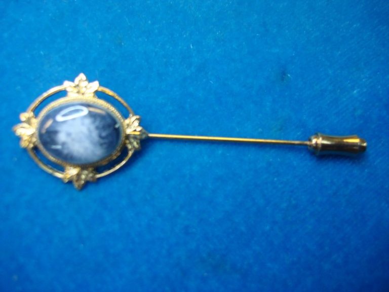 Vintage stick pin with blue and white stone