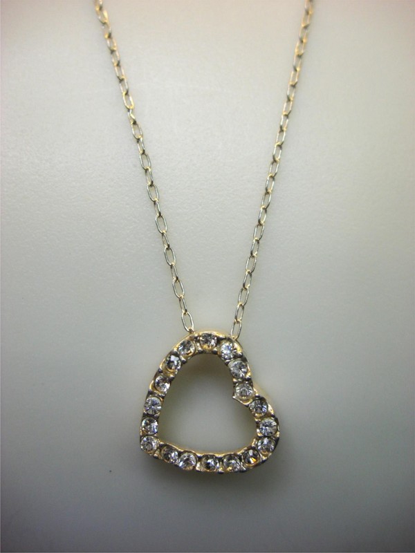 Sterling silver heart pendant with cubic zirconia stones and an 18-inch chain