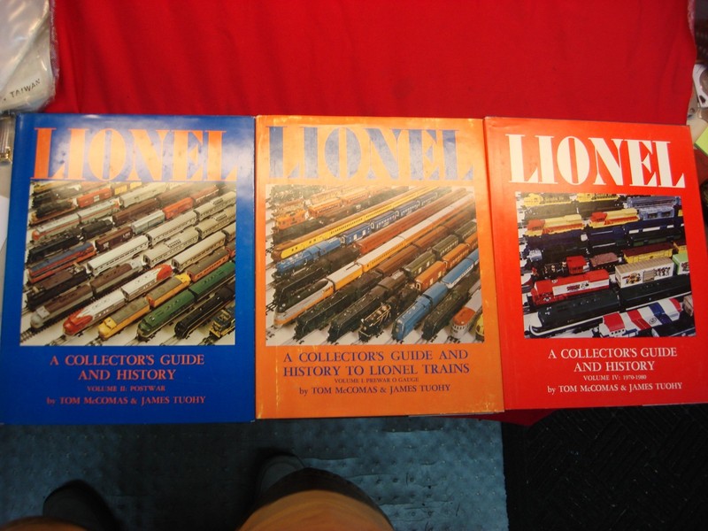 Set of three hardback McComas & Tuohy Lionel train collector's guides covering prewar, postwar, and 1970-1980 eras