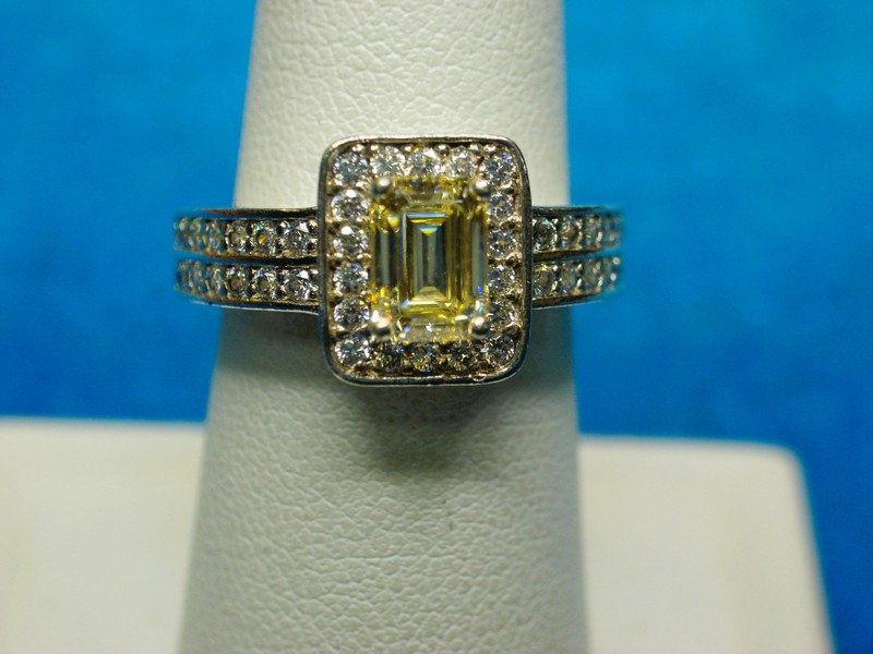 Elegant sterling silver ring with champagne-colored emerald-cut center stone and sparkling CZs, size 7