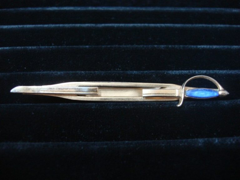 Vintage Swank gold-tone sword tie bar clip with blue stone