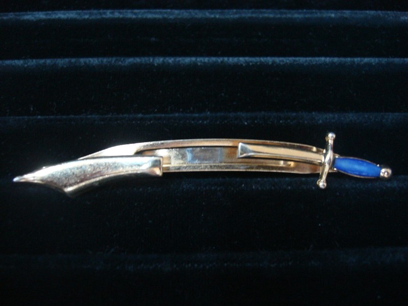Vintage Swank gold-tone sword tie bar clip with blue stone accent