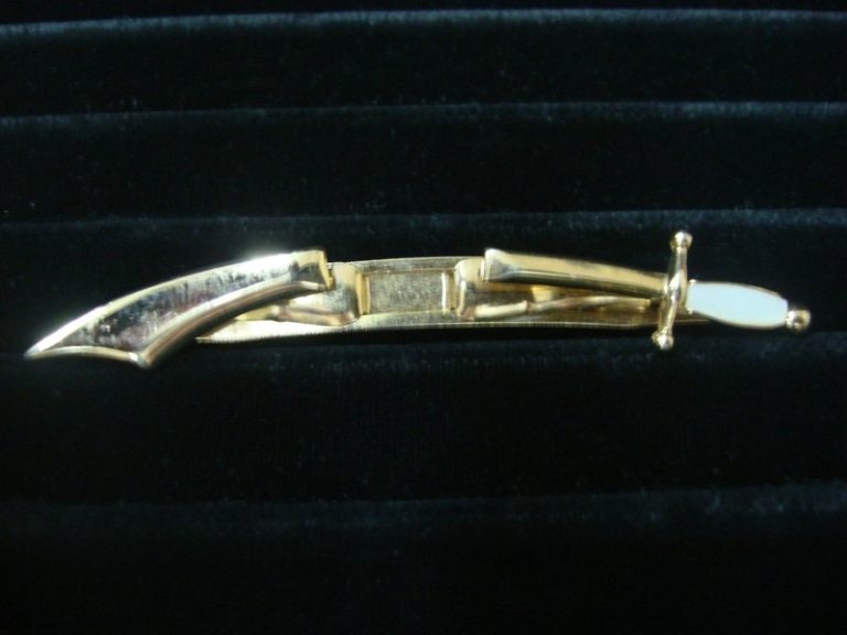 Vintage Swank gold-tone sword tie bar clip with white stone
