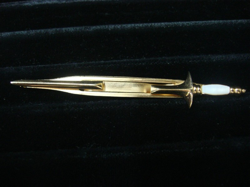 Vintage Swank gold tone sword tie bar clip with white stone accent