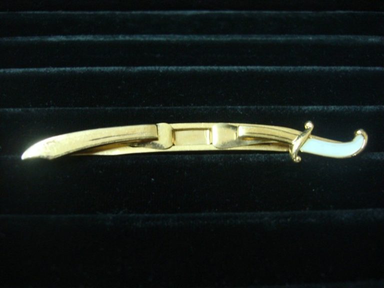 Vintage Swank gold-tone sword tie bar clip with a white stone
