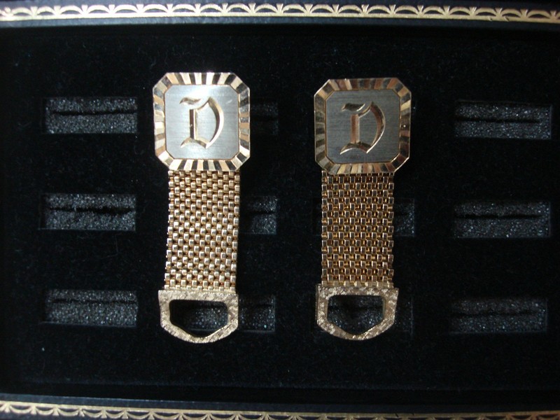 Vintage gold tone wrap-around cufflinks with 'D' initial