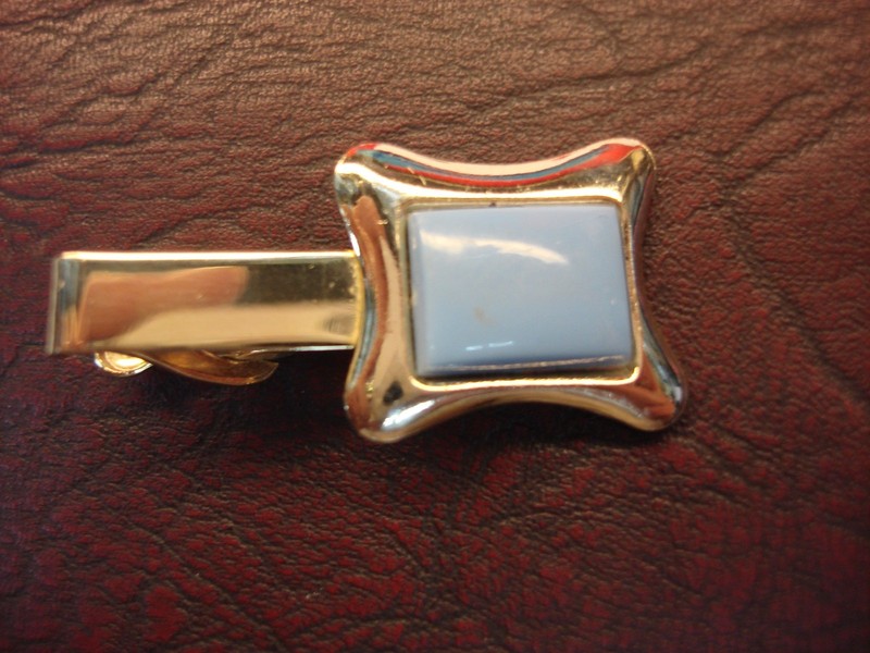 Vintage gold-tone tie clip with light blue stone