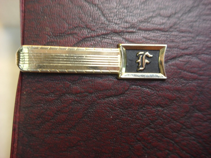 Vintage Hickok gold-tone tie clip with initial 'F' and enamel accents