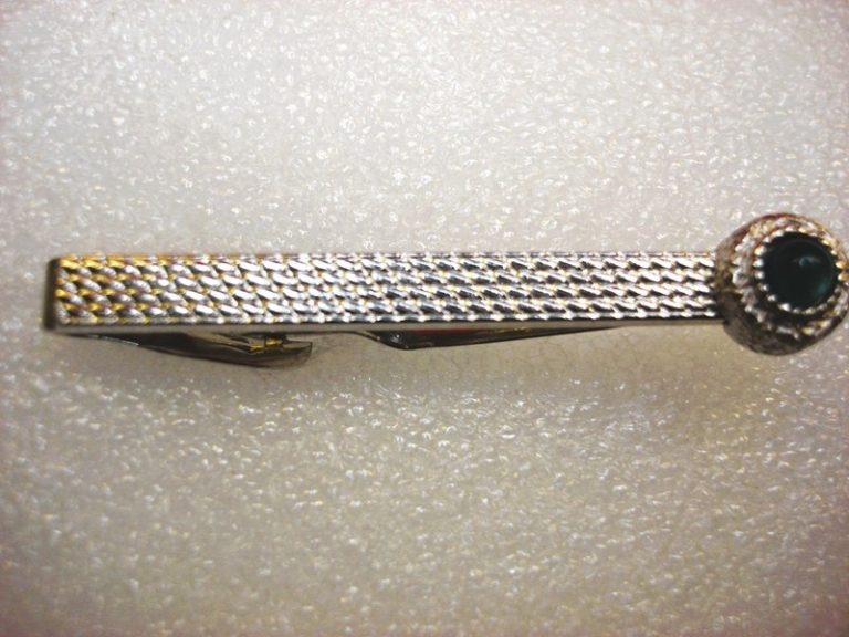 Vintage silver-tone tie clip with green stone and intricate pattern