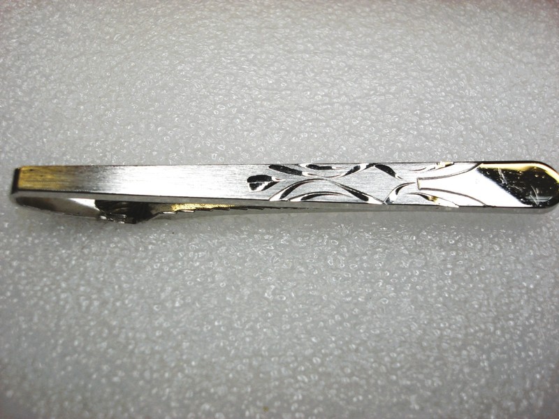 Vintage Anson silver-tone tie clip with intricate design, 2.5 inches