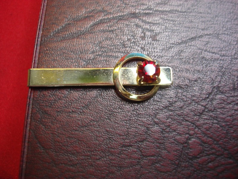 Vintage gold-tone tie clip with faux garnet stone