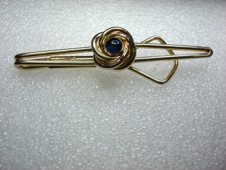 Vintage gold-tone Swank tie clip with dark blue stones