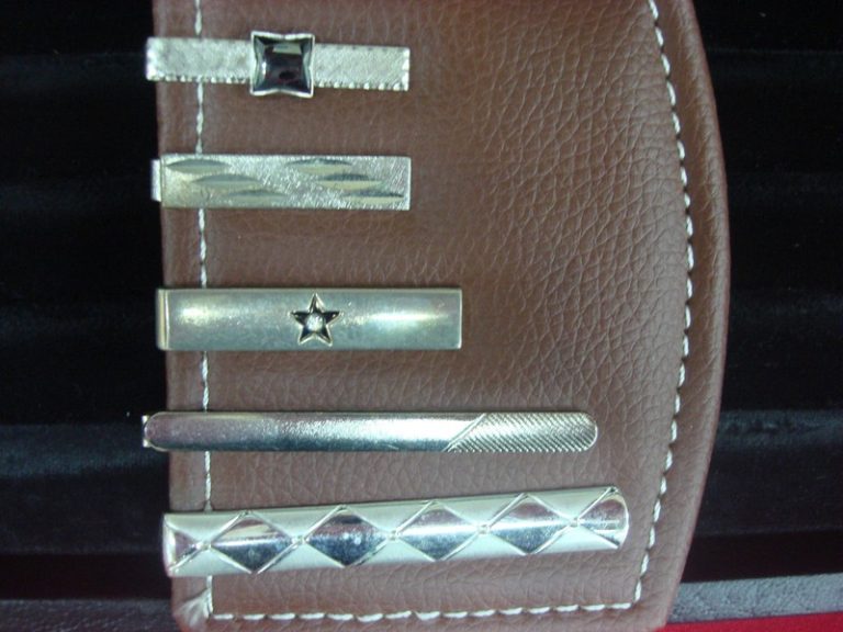 Set of five vintage silver-tone tie clips, each with a unique design