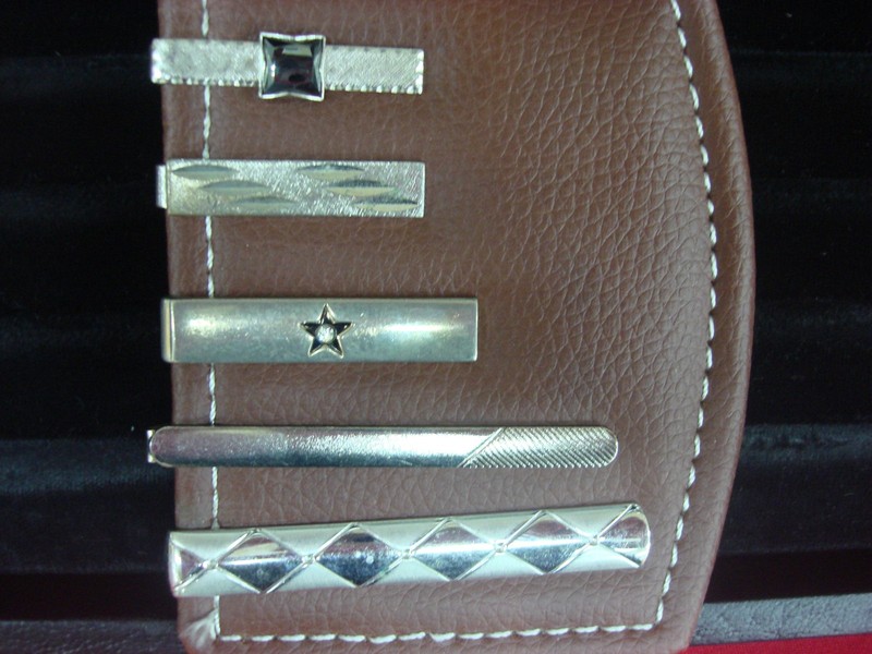 Set of five vintage silver-tone tie clips, each with a unique design