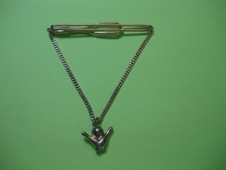 Vintage gold tone tie chain with bowling pin design, estate find