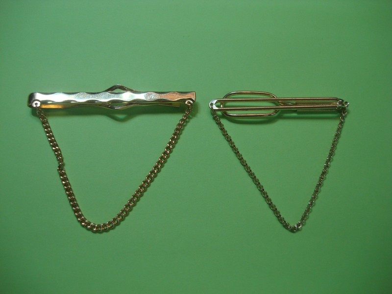 Two vintage gold-tone tie chains, one Anson and one Swank