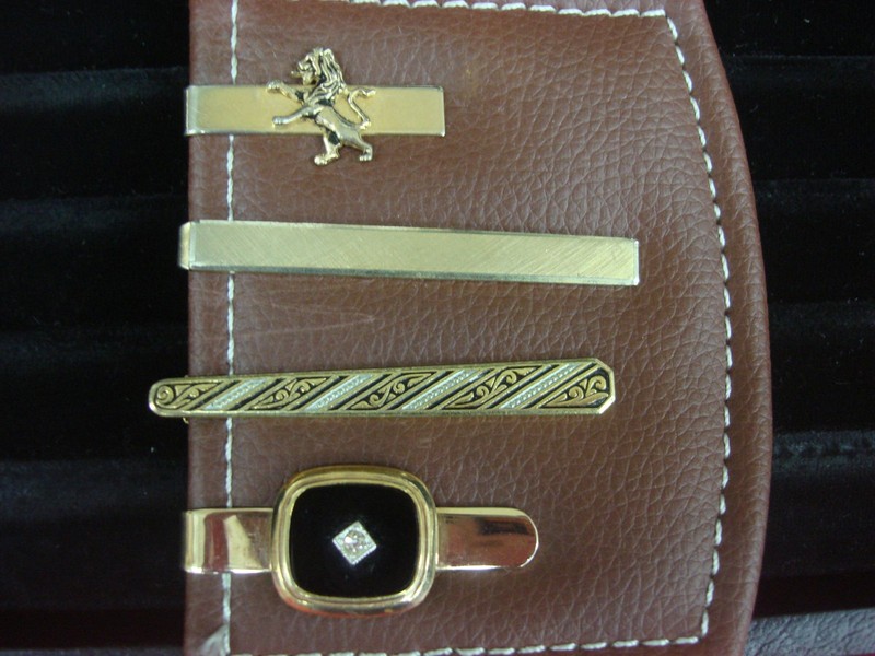 Set of four vintage gold-tone tie clips