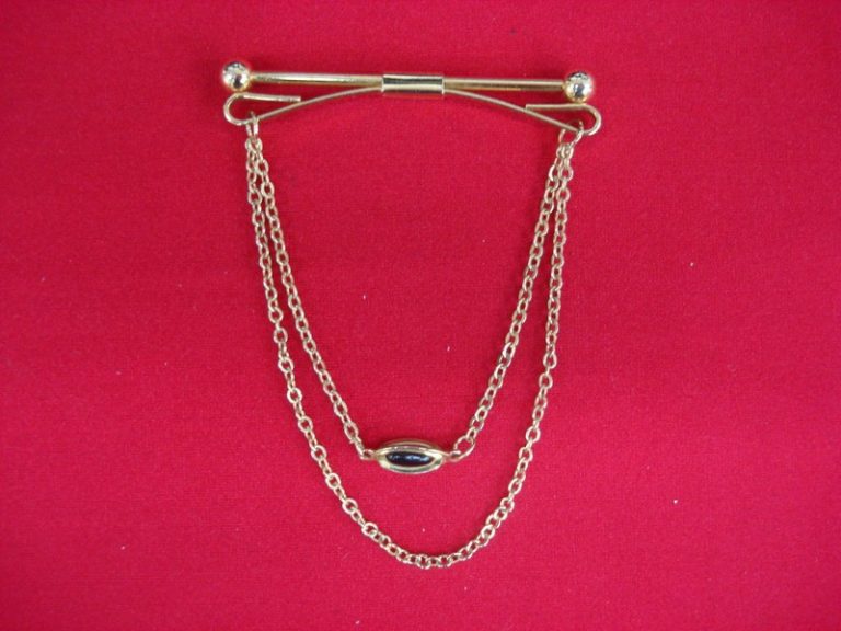 Vintage gold-tone tie bar chain with intricate design