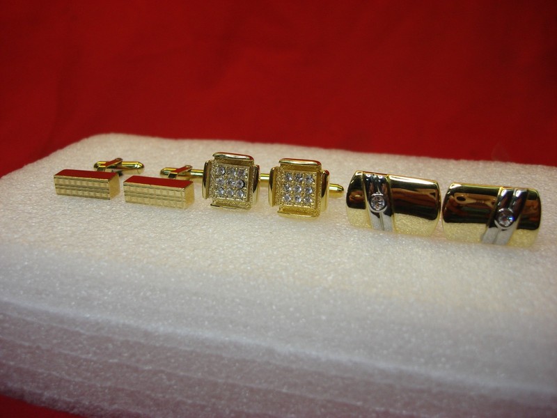 Three pairs of vintage gold-tone cufflinks, including a pair by Christian Dior and minimalist designs