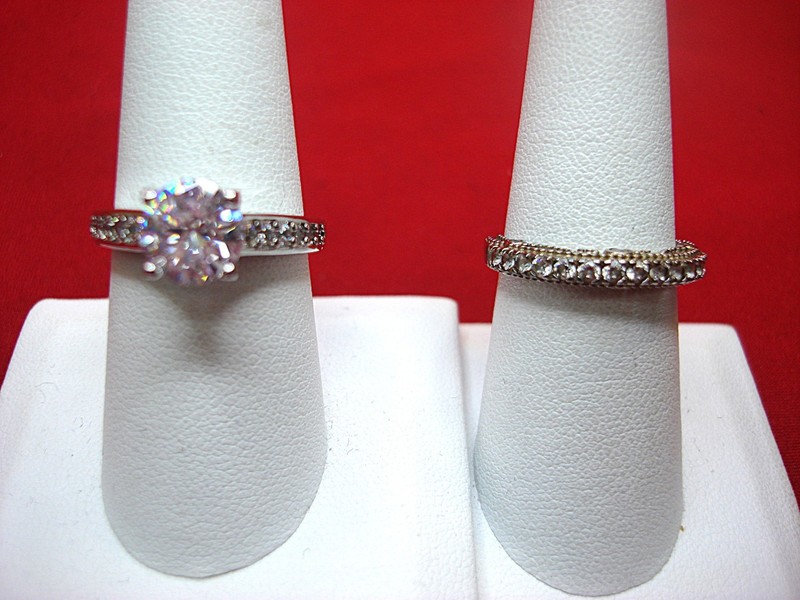 Sterling silver ring set of two with sparkling gemstones, sizes 8 and 7 1/4