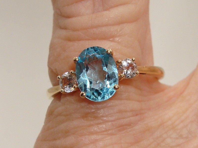 Blue topaz ring in 10K solid gold, oval cut