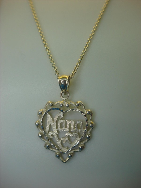 Sterling silver heart pendant necklace with 'Nana' engraved, on an 18-inch chain. Pre-owned, excellent condition.