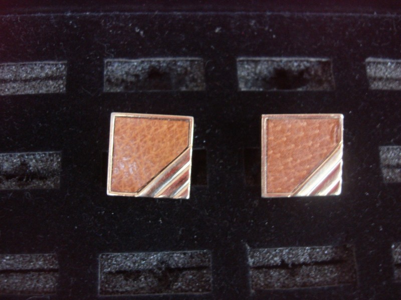 Vintage Swank gold-tone cufflinks, a pair of unique and collectible men's jewelry.