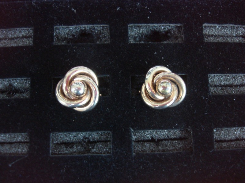 Vintage gold-tone cufflinks with a unique design, in excellent condition